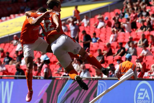 Kenny Dougall celebrates with Keshi Anderson after scoring their side's first goal during the Sky Bet League One Play-off Final match between Blackpool and Lincoln City at Wembley Stadium. (Photo by Catherine Ivill/Getty Images)
