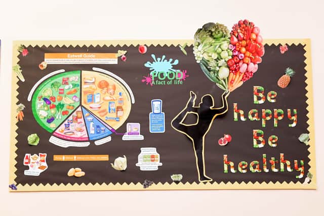 A colourful and informative board all about how to be happy and healthy