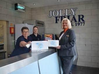 Jo Walker of Chestnut Homes with Jolly Friar manager Sharon Dennis and counter staff Ella Hawse