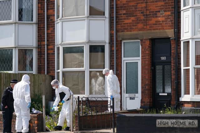 Police officers at the scene in High Holme Road, Louth, following the death of a woman and child on Monday. Picture: PA Wire.
