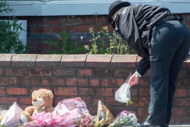 Tributes have been left outside the property in High Holme Road.