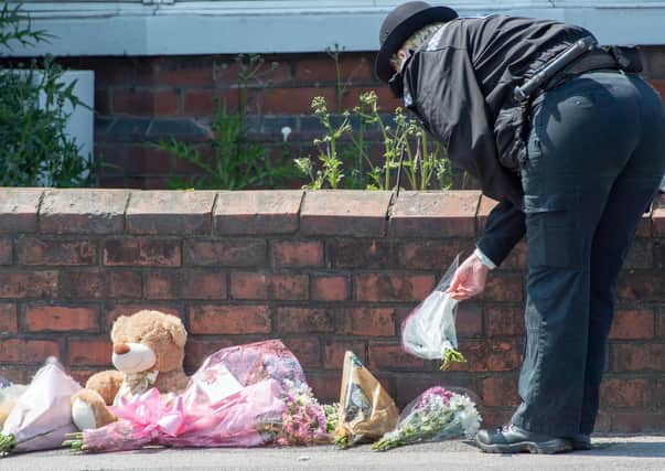Tributes have been left outside the property in High Holme Road.