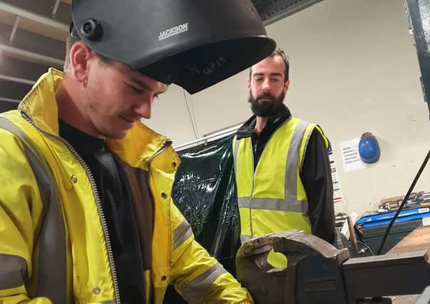 Stephen Spence, an engineering apprentice at Moy Park, supervised by Moy Park trainer, Jason Craig.