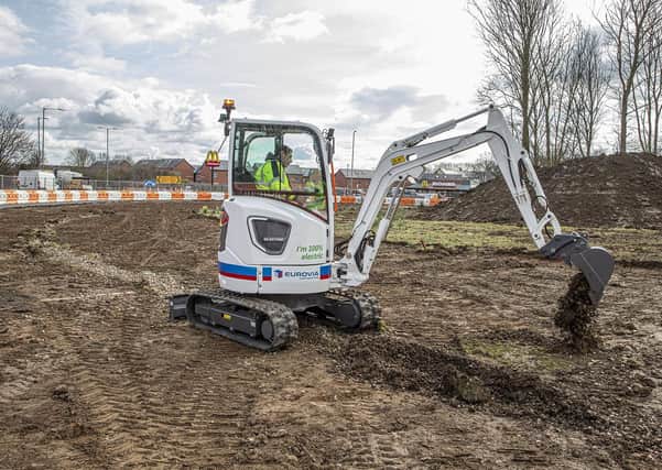 The Volvo electric excavator on site at Holdingham Roundabout. EMN-210706-144444001
