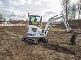 The Volvo electric excavator on site at Holdingham Roundabout. EMN-210706-144444001