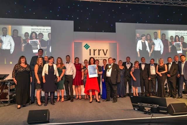 The revenues and benefits team receiving their award in 2018.