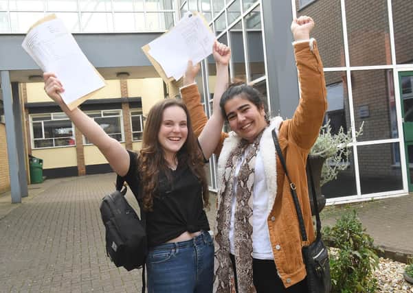 Scenes like these from two years ago won't be possible again this year due to pandemic precautions. 2019 GCSE results at Kesteven and Sleaford High School. L-R Tamzen Brenton 16, Rafia Khan 16 EMN-190822-182601001