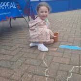 Masi Andrews, 5, of Tamworth, Birmingham, colouring in a poppy.