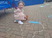 Masi Andrews, 5, of Tamworth, Birmingham, colouring in a poppy.