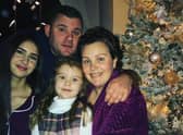 Carly (right) with her partner, Adam, and daughters Farrah, 5, and Chloe, 19.