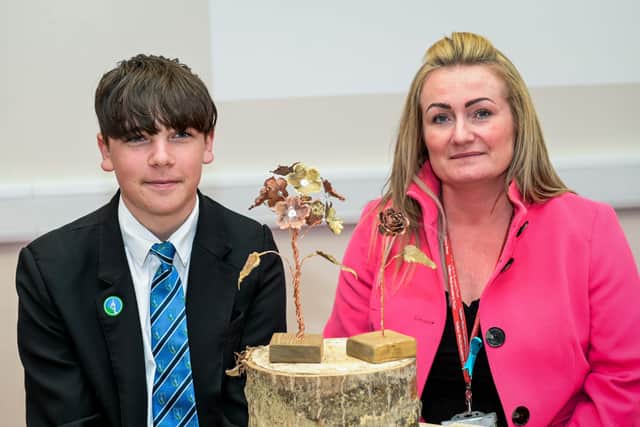 James Gilliatt with some of the metalwork sculptures he has created to put a smile on his mum’s face. He is pictured with Louth Academy Head of Design and Technology, Meicah Pickwell.