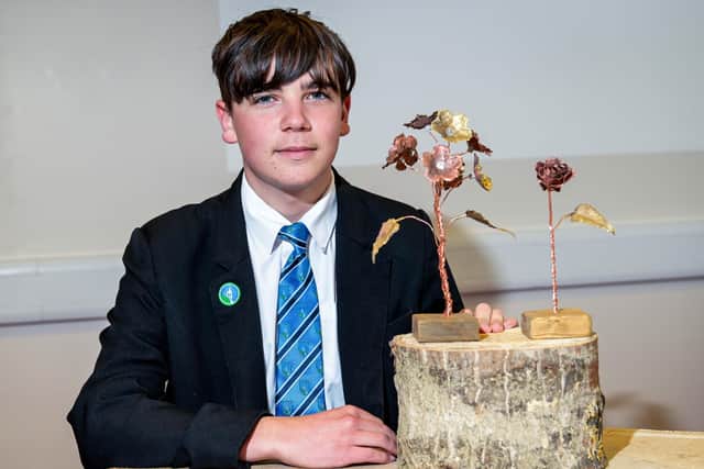 Year 10 student James Gilliatt with some of the metalwork sculptures he has created to put a smile on his mum’s face. (Photo: Jon Corken)