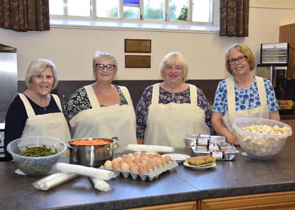 Norma Higton, second right, with, from left, Judy Dixon, Fiona Blackburn, and Kath Edmondson,who worked every week for the past 15 months.
Photo by John Edwards EMN-210614-152742001