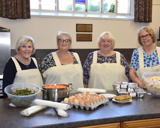 Norma Higton, second right, with, from left, Judy Dixon, Fiona Blackburn,  and Kath Edmondson,who worked every week for the past 15 months.
Photo by John Edwards EMN-210614-152742001