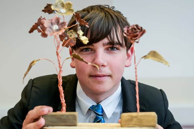 Year 10 student James Gilliatt with some of the metalwork sculptures he has created to put a smile on his mum’s face. (Photo: Jon Corken)