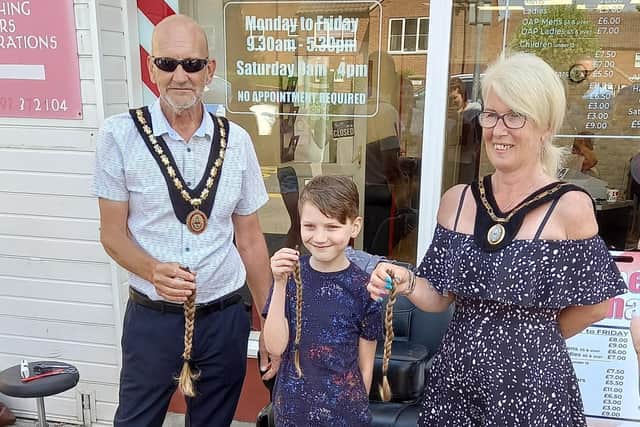 Finley is congratulated on his new haircut by the Mayor of Skegness Coun Trevor Burnham.