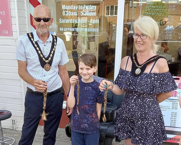 Finley is congratulated on his new haircut by the Mayor of Skegness Coun Trevor Burnham.