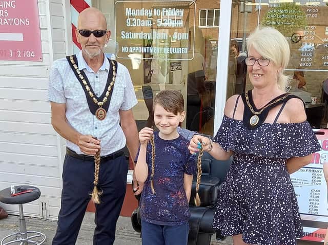 Finley is congratulated on his new haircut by the Mayor of Skegness Coun Trevor Burnham.