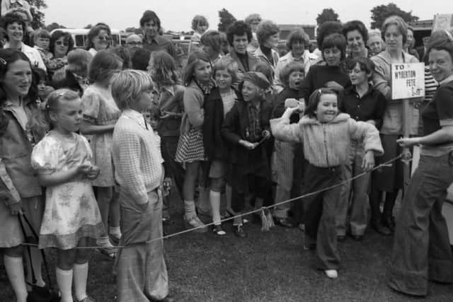 A youngster gets set to release a wet sponge at Wyberton Primary School's summer fete 45 years ago.
