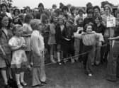 A youngster gets set to release a wet sponge at Wyberton Primary School's summer fete 45 years ago.
