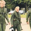 Brian May and Kerry Ellis with Group Captain Dave Waddington, station commander at RAF Cranwell.