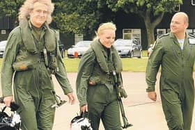 Brian May and Kerry Ellis with Group Captain Dave Waddington, station commander at RAF Cranwell.