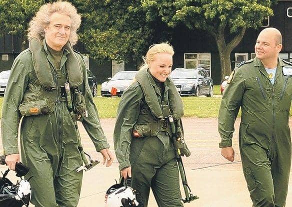 Brian May and Kerry Ellis with Group Captain Dave Waddington, station commander at RAF Cranwell.