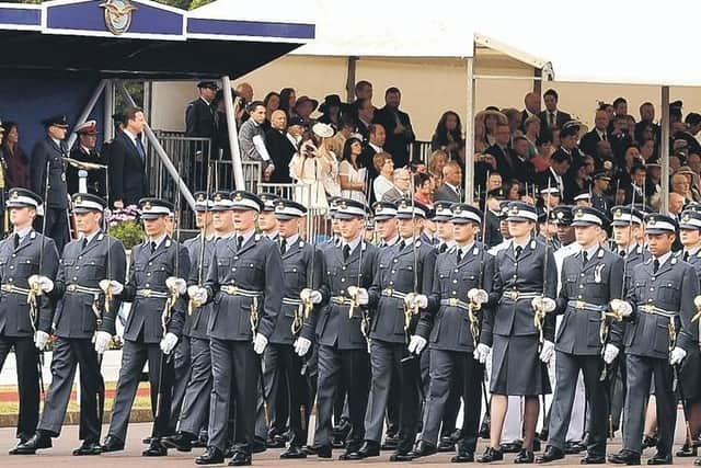 The then Prime Minister David Cameron reviews the parade.