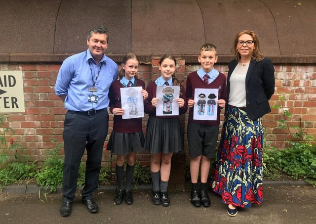 William Alvey School headteacher, Stephen Tapley and Affinity's Alex Davison and pupils holding some of their Imp designs. EMN-210618-123635001