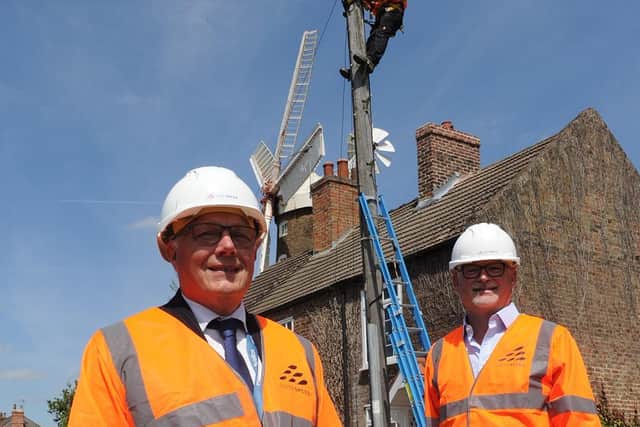 (L-R) Coun Paul Skinner (left), Leader of Boston Borough Council and Dave Axam, Chief Operating Officer at Lightspeed Broadband celebrating the progress of Lightspeed Broadband's network build in front of Maud Foster Mill in Boston.