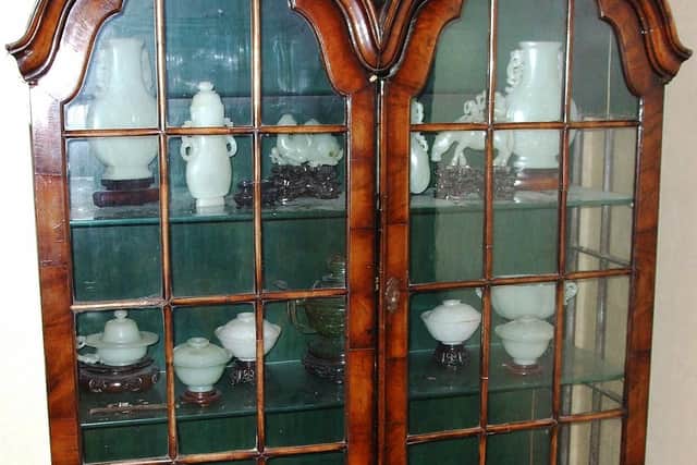 Chinese jade antiques in the display cabinet.