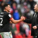 SUNDERLAND, ENGLAND - MAY 22: Michael Appleton Manager of Lincoln congratulates Regan Poole (l) after the Sky Bet League One Play-off Semi Final 2nd Leg match between Sunderland and Lincoln City  at Stadium of Light on May 22, 2021 in Sunderland, England. (Photo by Stu Forster/Getty Images) 775653777