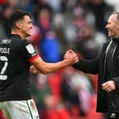 SUNDERLAND, ENGLAND - MAY 22: Michael Appleton Manager of Lincoln congratulates Regan Poole (l) after the Sky Bet League One Play-off Semi Final 2nd Leg match between Sunderland and Lincoln City  at Stadium of Light on May 22, 2021 in Sunderland, England. (Photo by Stu Forster/Getty Images) 775653777