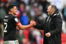 SUNDERLAND, ENGLAND - MAY 22: Michael Appleton Manager of Lincoln congratulates Regan Poole (l) after the Sky Bet League One Play-off Semi Final 2nd Leg match between Sunderland and Lincoln City  at Stadium of Light on May 22, 2021 in Sunderland, England. (Photo by Stu Forster/Getty Images) 775653777
