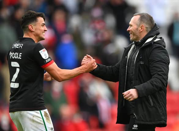 SUNDERLAND, ENGLAND - MAY 22: Michael Appleton Manager of Lincoln congratulates Regan Poole (l) after the Sky Bet League One Play-off Semi Final 2nd Leg match between Sunderland and Lincoln City at Stadium of Light on May 22, 2021 in Sunderland, England. (Photo by Stu Forster/Getty Images) 775653777