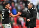 SUNDERLAND, ENGLAND - MAY 22: Michael Appleton Manager of Lincoln congratulates Regan Poole (l) after the Sky Bet League One Play-off Semi Final 2nd Leg match between Sunderland and Lincoln City  at Stadium of Light on May 22, 2021 in Sunderland, England. (Photo by Stu Forster/Getty Images) 775653777