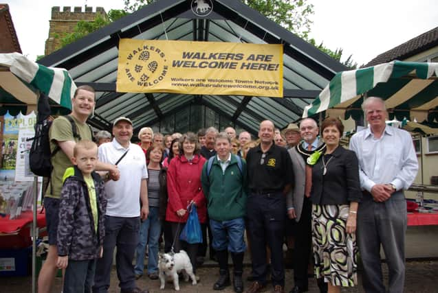 Mike Eckersley, left,being congratulated by Lincolnshire Ramblers honorary secretary Stuart Parker back in 2011 as Market Rasen became a Walkers Are Welcome town. EMN-210622-104335001