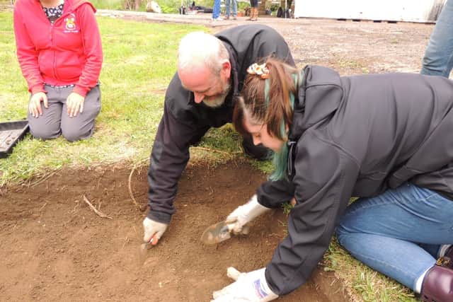 Digging on the site of the old driveway to the manor house. EMN-210628-181532001