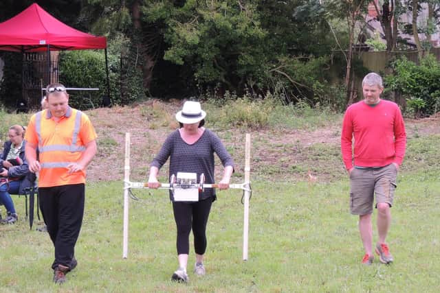 Ryan Godbold of Heritage Lincolnshire gives Chris and Claire Rogers a masterclass in geophysical surveying in the grounds of Heckington Manor. EMN-210628-181451001