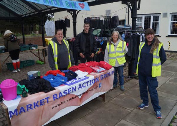 Members of Market Rasen Action group at the unifrom bank stall, which will return this weekend EMN-210622-084701001