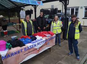 Members of Market Rasen Action group at the unifrom bank stall, which will return this weekend EMN-210622-084701001