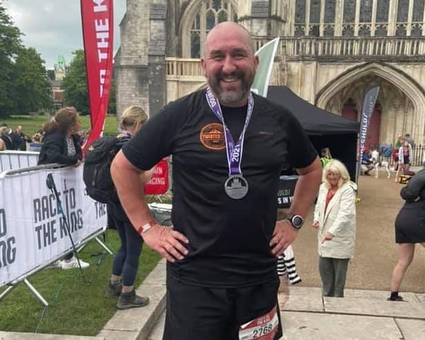 Mark Booth on completing the Race to the King on the South Downs Way. EMN-210625-142955001