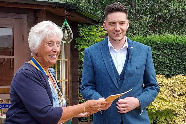 President Barbara Roberts welcomes new Rotary Club member Matt Waldeck. EMN-210625-151643001