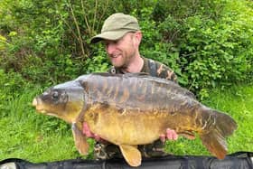 Dan Smith with a 40lb mirror carp.