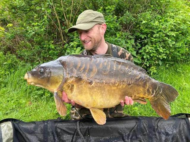 Dan Smith with a 40lb mirror carp.