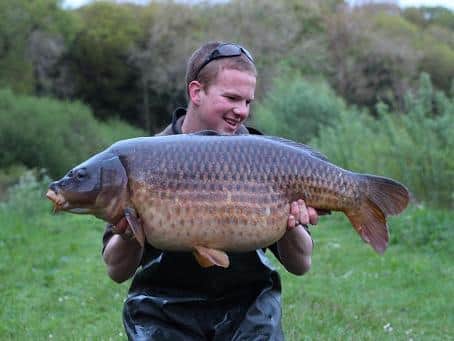 Liam Sandall with 'The Unit' common carp.