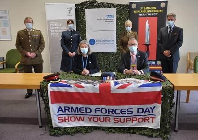 Re-signing the Armed Forces Covenant. Pictured in front are Elaine Baylis and Chief Executive, Andrew Morgan, with, across the back from left - Lincolnshire Local Resilience Forum Military Liaison Officer, Major Mitch Pegg, RAF medic based at RAF Scampton, Sgt Sarah Holt, Advance Nurse Practitioner for Lincolnshire Community Health Services as well as Senior Nursing Officer in 212 Field Hospital Reservist Lieutenant Colonel Lindsay Baigent, and East Midlands Regional Employer Engagement Director at the Reserve Forces’ and Cadets’ Association, Bruce Spencer. EMN-210624-105313001