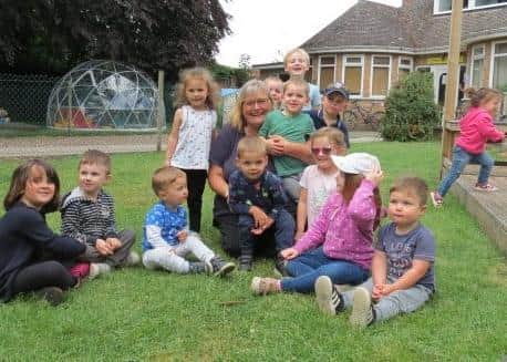 Sonia Elton pictured with some of the children at Bearhugs Nursery