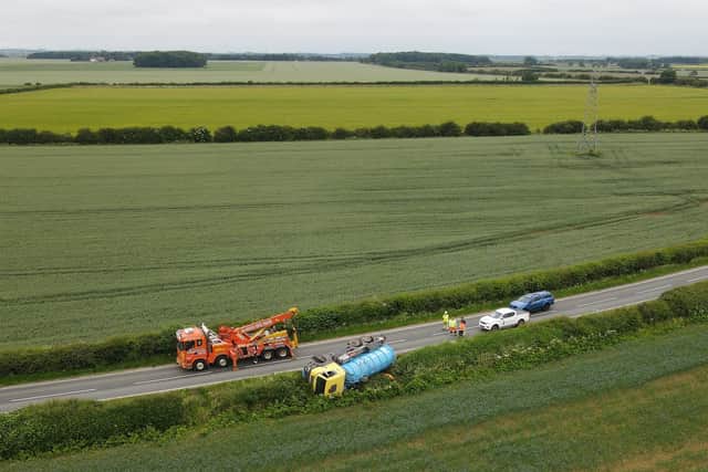 John Siddle got these drone shots of the overturned tanker on the B1188 south of Digby. EMN-210625-110212001