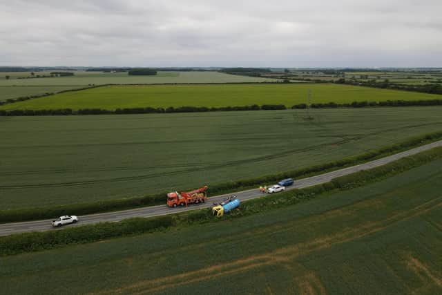 Surrounded by fields. The B1188 had to be closed for an hour or two yesterday afternoon (Thursday) to right an HGV tanker that had run off the road that morning. Photo: John Siddle EMN-210625-110136001
